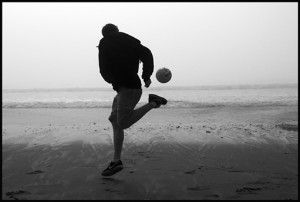 A combination of fog, low tide, big surf and people out celebrating Sunday/Valentine's Day made for some fun photographs at Seacliff beach yesterday.  This kid shows he's still got some soccer moves! made for 