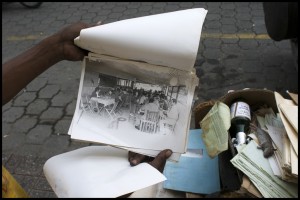 Photo I like. Titled "Photos and Rat". When some workers saw I was interested in the photos they had cleared out of a building and piled on the sidewalk, they really got into showing them to me. They gave me a few choice 5x7s. 