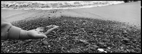 The sea glass hunters are out in force on the beaches south of Capitola. If this photo were in color you'd see a piece of blue glass that she was particularly pleased to have found.