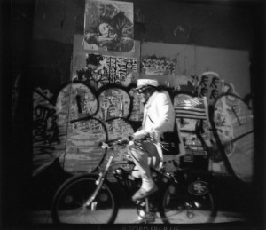 I was photographing on Mission Street in San Francisco the other day. This guy on a bike came peddling up  the block rapidly. I just had enough time to get my Holga up to my eye and "click". I wonder how he got that flag to fly that way? 