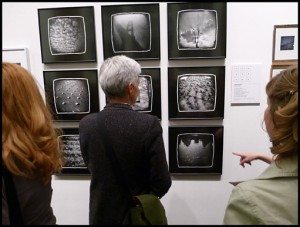 Alice contemplating the work of featured artist Michelle Bates.