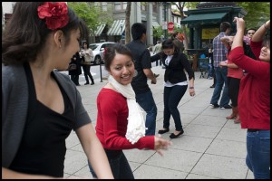 Sabrosura, a student run Latin dance group from UCSC, hold down the corner of Pacific and Cooper yesterday afternoon.