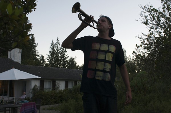 It's become a tradition for Cooper to blow the bugle on the evening of the 3rd.  I made a photo very similar to this one in 2008 for my "Photo a Day" project.