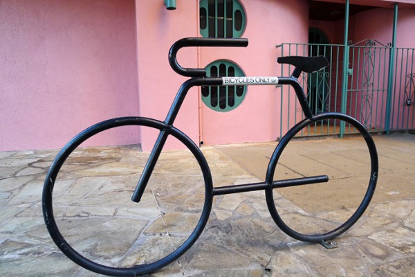 Bike rack and pink wall, Honolulu, HI.