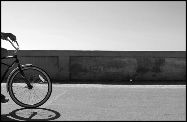 I'm just back from a trip to San Diego. I didn't do a whole lot of photography while I was visiting but I snapped a few pics here and there. This one was taken on the bike, skate, jogging, walking path that runs along Pacific Beach and Mission Beach. I sat on a bench for a long time snapping beach bike photos. I like this one the best.