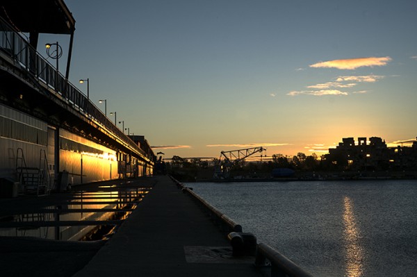 Sunrise at the Vieux Port. Across the way is Habitat 67 designed by architect Moshe Safdie. 158 interlocking concrete forms reflecting cities of the future when population would outgrow urban space. 